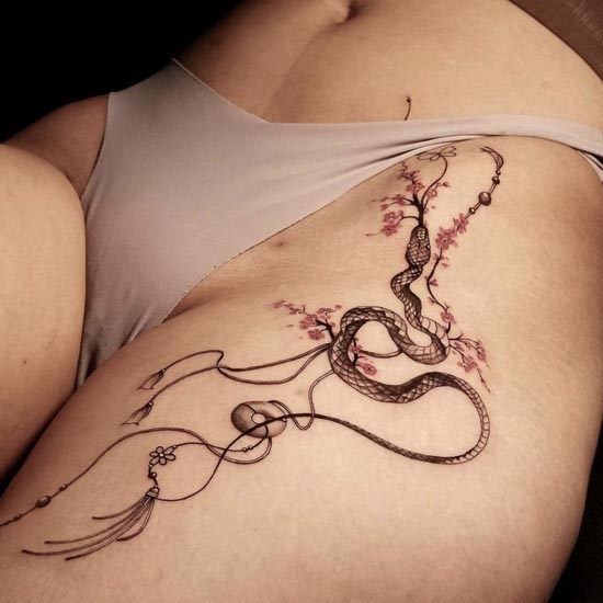 cherry blossom snake dream catcher sexy tattoo lady inside hip